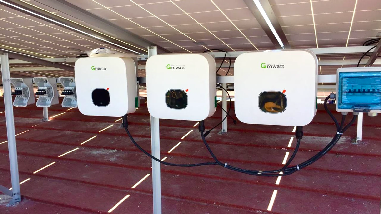 Solar inverters installed beneath a photovoltaic canopy